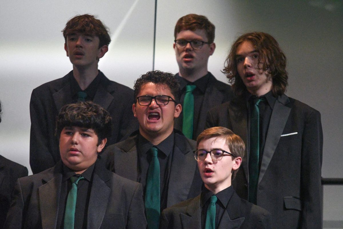 Senior Jesse Ramirez sings in the center of a section of choir boys during the UIL preview concert in March. He has been a four-year member of the choir program.