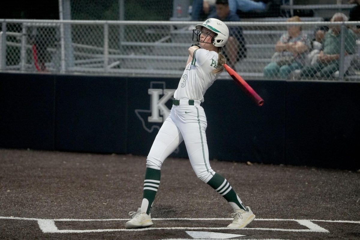 Senior Ava Klinefelter looks up at her ball after hitting. Klinefelter hit two home runs in the game against West Fork, contributing to the 9-3 win. 
