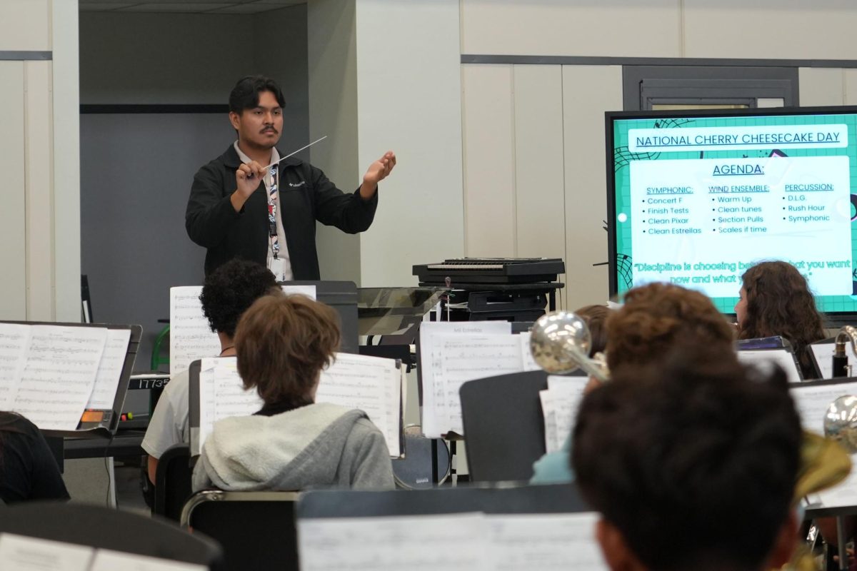 Assistant band director Francisco Espinoza works with the non-varsity symphonic band during fourth period. Espinoza stepped up as assistant director after being a tech.