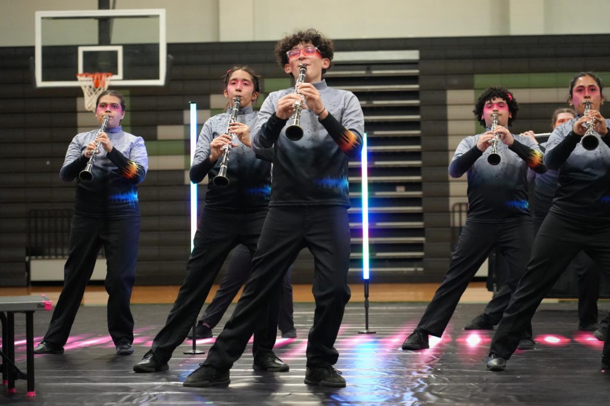 During the Soundscapes band performance, freshmen Layla Driscoll, Eliana Calle, Christos Karavantos-Love play the clarinet at the front of the section. 