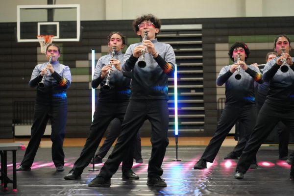 During the Soundscapes band performance, freshmen Layla Driscoll, Eliana Calle, Christos Karavantos-Love play the clarinet at the front of the section. 