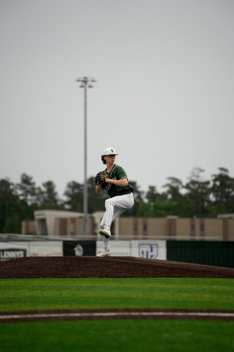 Sophomore Finn Stevens picks his leg up while pitching the ball towards a Splendora player. 
