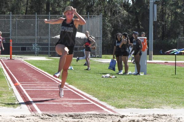 Senior Madison Staggs competes in the triple jump at a home meet on March 13. She holds the school record in the event.