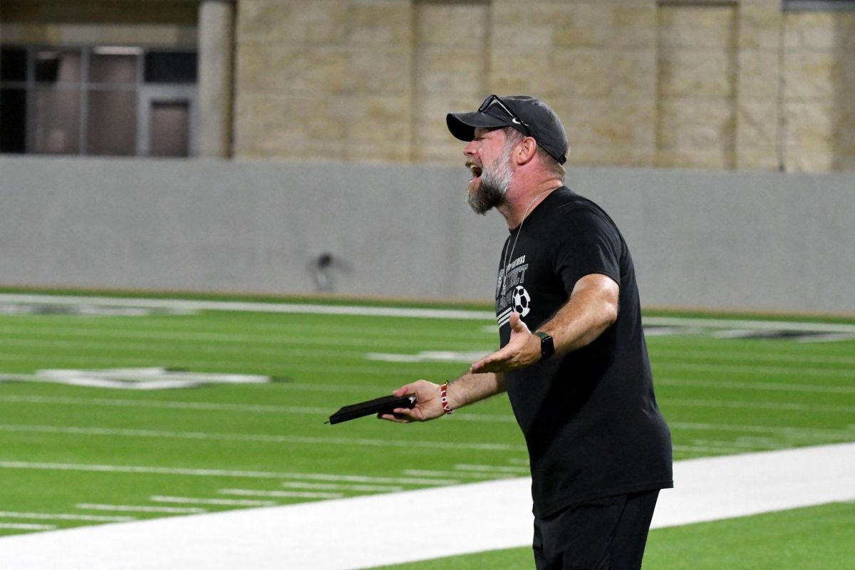 During the game against A&M Consolidated on March 31, coach Jess White yells at the officials from the sideline. 