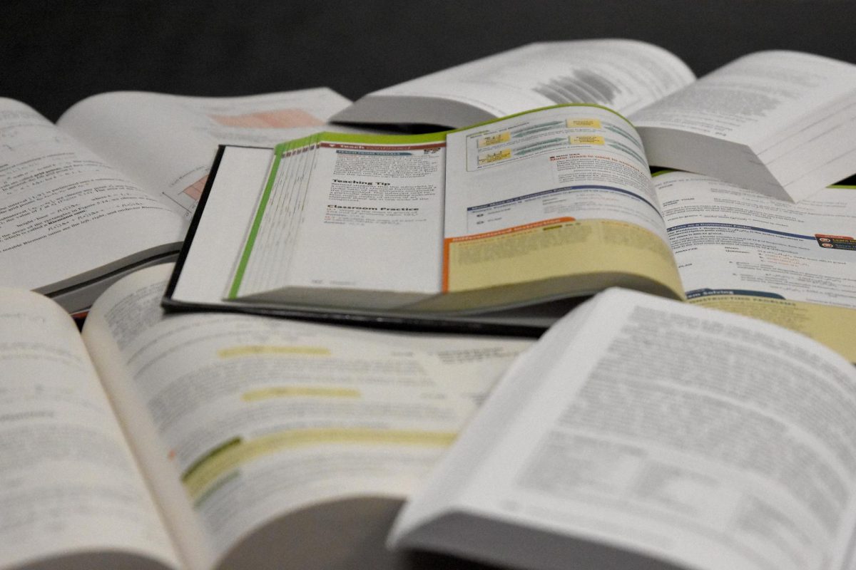 While textbooks are no longer regularly issued to students, there are still classroom sets sitting on shelves along with AP test study guides.