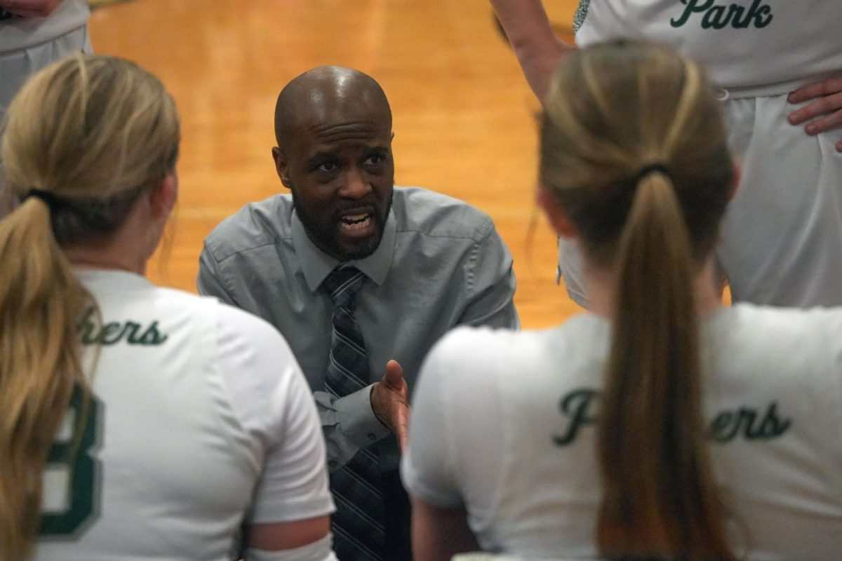 Coach Andrew Cross talks to his players during a timeout in a game against West Fork on Jan. 29. 