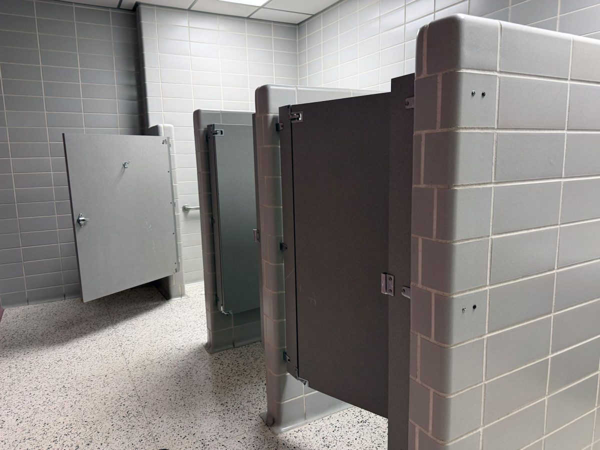 Bathroom stalls in the tile area of campus have short doors that create a lack of privacy for those going to the bathroom, especially during passing periods when the bathrooms are the busiest.