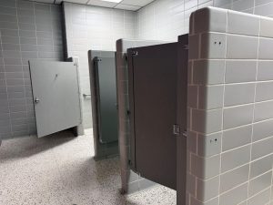 Bathroom stalls in the tile area of campus have short doors that create a lack of privacy for those going to the bathroom, especially during passing periods when the bathrooms are the busiest.
