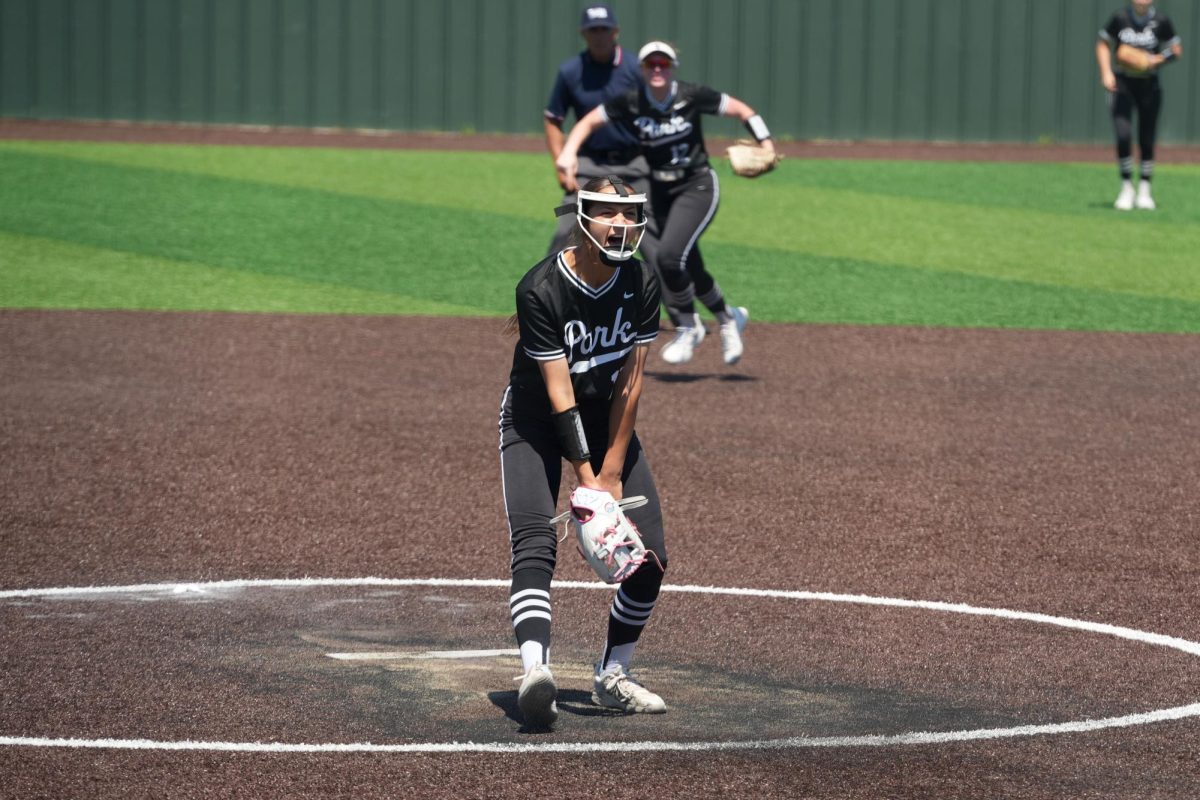 Freshman Trinity Brents yells in the pitcher's mound after throwing the last strikeout to make the team Area champions. Brents threw two complete games in the series at Summer Creek and only allowed 2 runs scored. 
