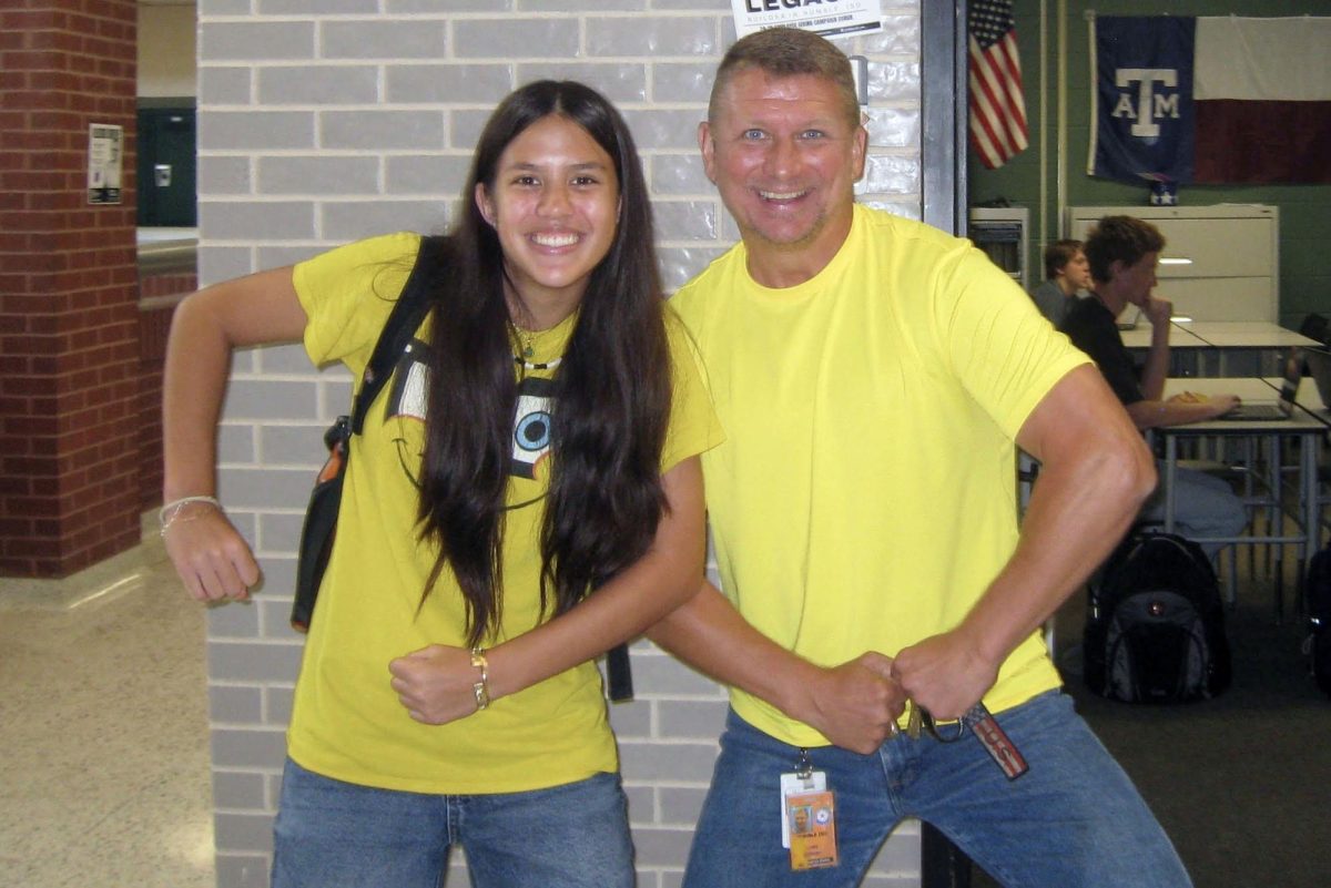 Sophomore Katelyn Malone and coach Luke Gorney dressed up similarly on Go Gold Day in September. Gorney has coached Malone the past two years in JV soccer.